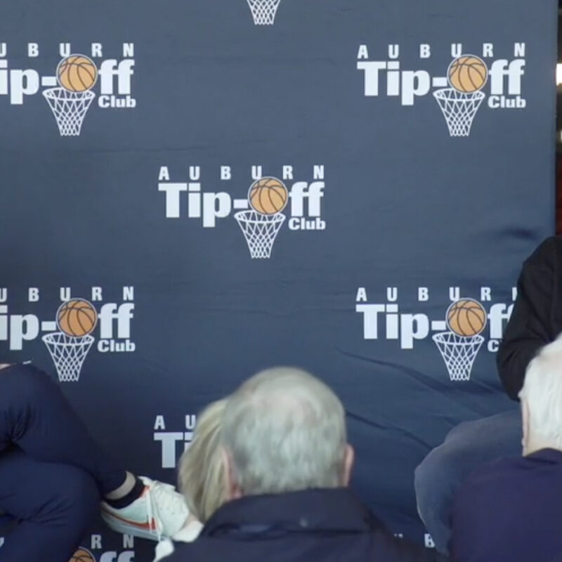 Tip-Off Club President Jason Harbison interviews Auburn Guard Kevin Overton.